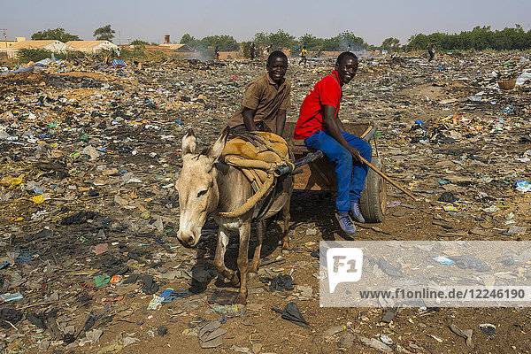 Friendly boys on a public rubbishdump  Niamey  Niger  Africa
