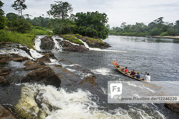 Tourist boat below the Lobe waterfalls  Kribi  Cameroon  Africa