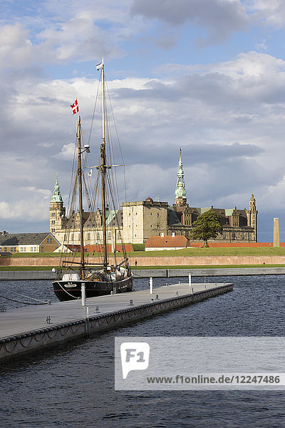 Tall ship in harbour with Kronborg Castle used as setting for Shakespeare's Hamlet  Helsingor  Zealand  Denmark  Scandinavia  Europe