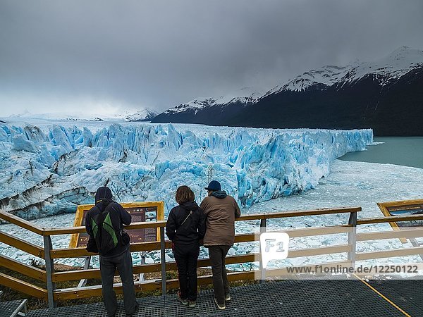 Tourists on a viewing platform at the Perito Moreno glacier  region of El Calafate  province of Santa Cruz  Patagonia  Argentina  South America