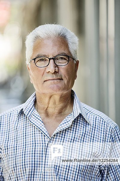 Grey-haired Senior with glasses  migration background  native Italian  portrait  Germany  Europe