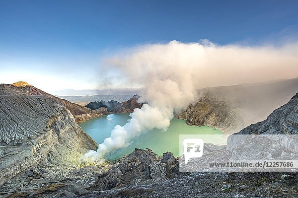 Volcano Kawah Ijen  volcanic crater with crater lake and steaming vents  morning light  Banyuwangi  Sempol  Jawa Timur  Indonesia  Asia