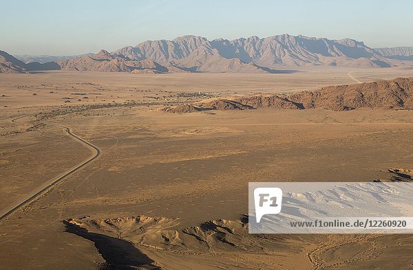 Arid plains and isolated mountain ridges  Namib Desert  behind the settlement of Sesriem  aerial view  Namib-Naukluft National Park  Namibia  Africa