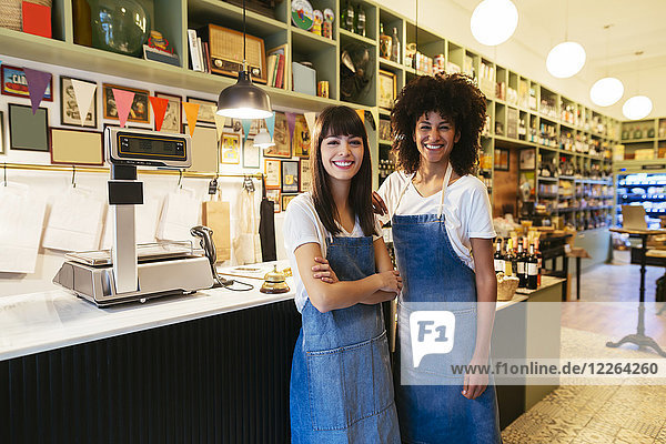 Portrait of two smiling women in a store