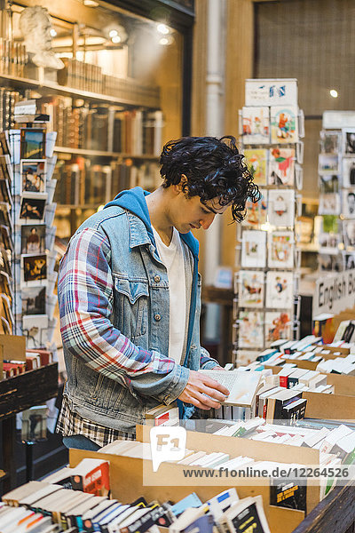 Young man in bookshop