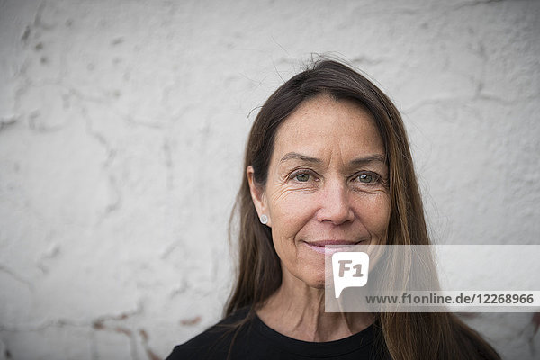Portrait of brown-haired middle-aged woman looking at camera and smiling  Denver  Colorado  USA