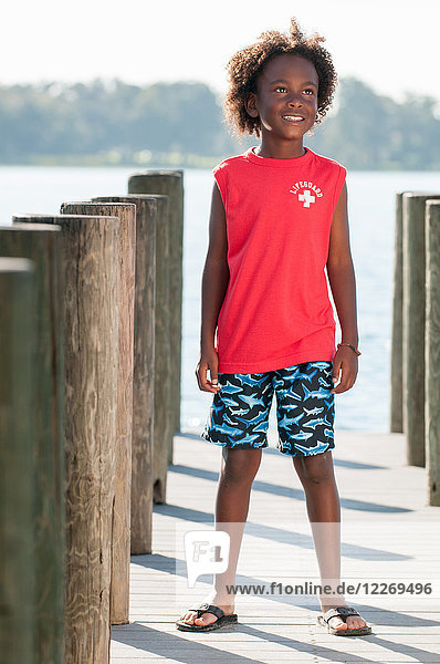Portrait of young boy standing on pier  Winter Park  Florida  USA