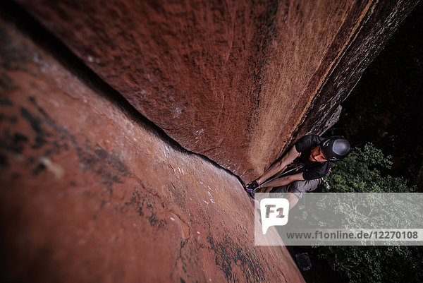 Rock climber climbing sandstone rock  overhead view  Liming  Yunnan Province  China