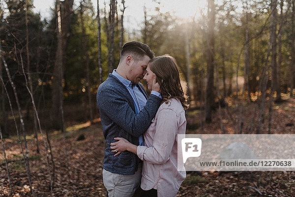 Young couple kissing in forest  Ottawa  Canada