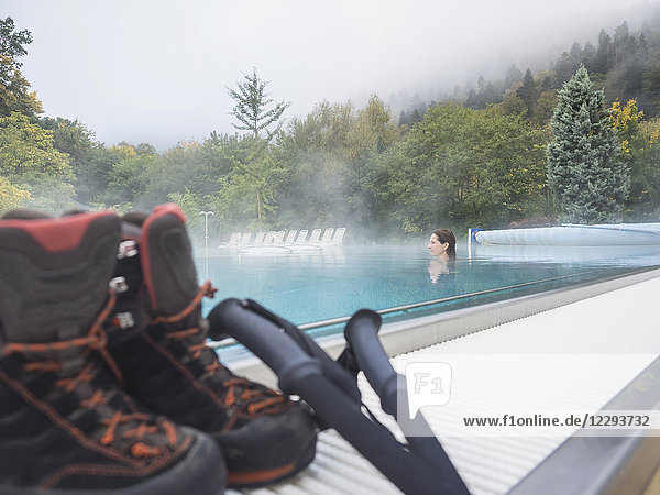 Woman hiker relaxing in swimming pool of Paracelsus-Therme  Bad Liebenzell  Baden-Württemberg  Germany