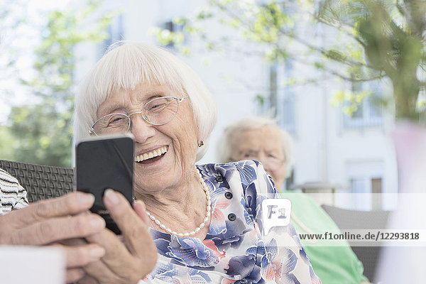 Senior woman looking at smartphone