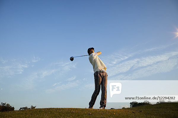 Japanese golf player on course