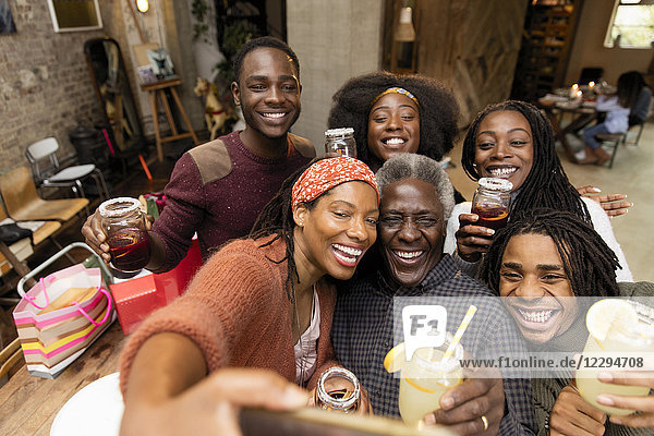 Happy multi-generation family taking selfie
