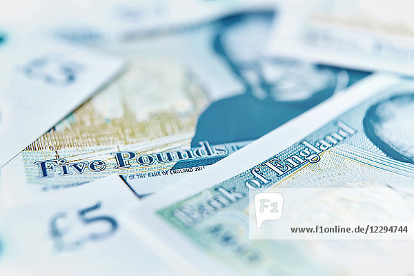 Close up five pound notes