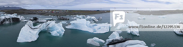 Panoramic view of icebergs in water against sky  Jökulsárlón  Iceland