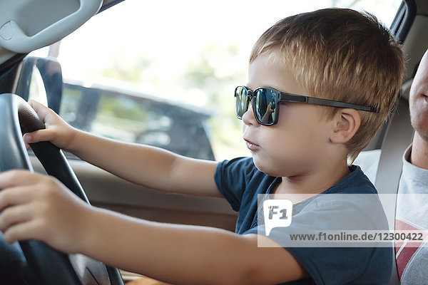 Little boy driving car