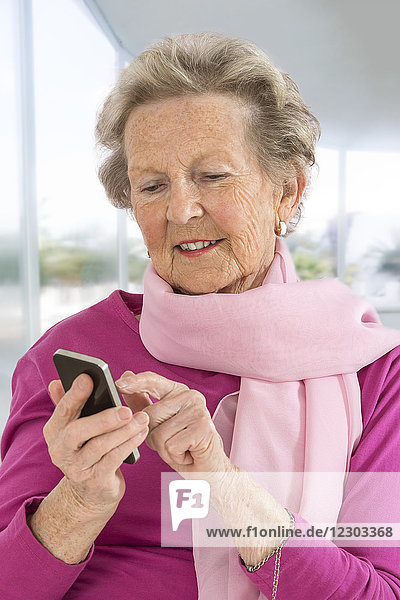 Senior woman using a smartphone.