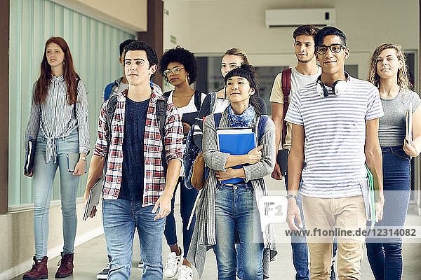 Students walking in school corridor