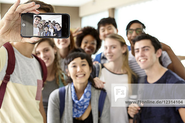 School friends posing together for selfie