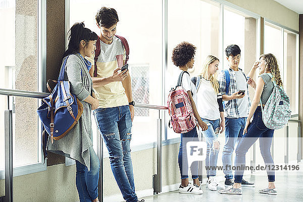 Students hanging out in school corridor between classes