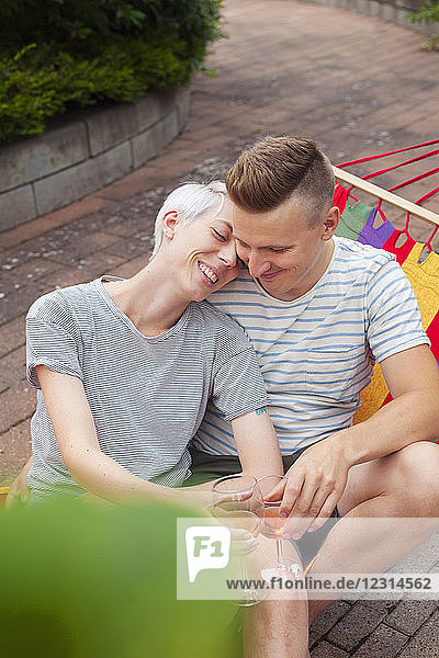 Couple drinking white wine in garden