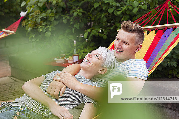 Couple relaxing on hammock