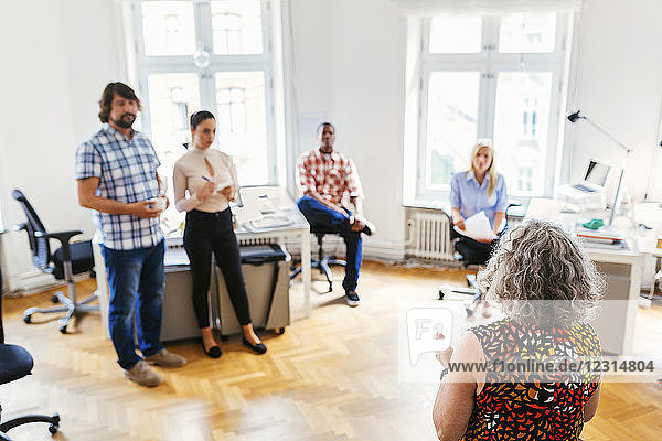 Coworkers during business meeting in office