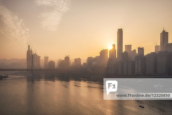 Chongqing city skyline at dawn  with the view of the Yuzhong peninsula CBD and Jialing River  Chongqing  China  Asia