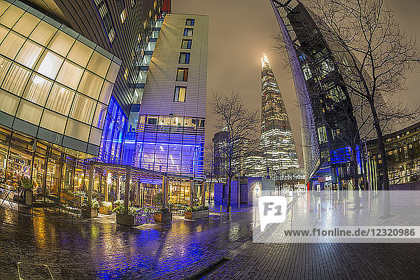 Fisheye view of More London skyline and The Shard visible in background at night  Southwark  London  England  United Kingdom  Europe