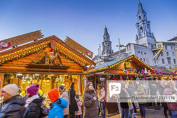 View of visitors and Christmas Market stalls at Christmas Market  Millennium Square  Leeds  Yorkshire  England  United Kingdom  Europe