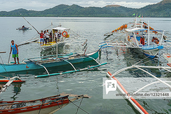 Early morning bangka taxis (outrigger canoes)  Coron Harbour  Busuanga island  Philippines  Southeast Asia  Asia