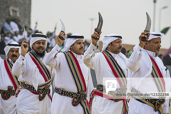 Traditional dressed local tribesmen dancing at the Al Janadriyah Festival  Riyadh  Saudi Arabia  Middle East