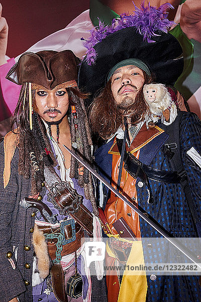 Japanese men dressed as Captain Jack Sparrow and Captain Barbossa from the Pirates of the Caribbean on Halloween in Shibuya  Tokyo  Japan  Asia