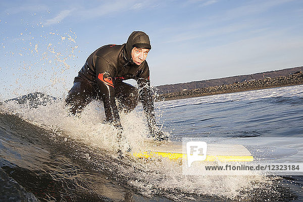 Man surfing  South-central Alaska; Homer  Alaska  United States of America