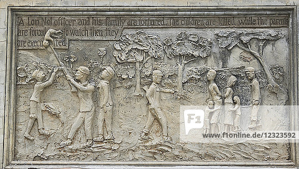 Bas-relief depicting the atrocities committed by the Khmer Rouge at the base of the memorial stupa to the victims of the Khmer Rouge at Wat Samrong Knong; Battambang  Cambodia