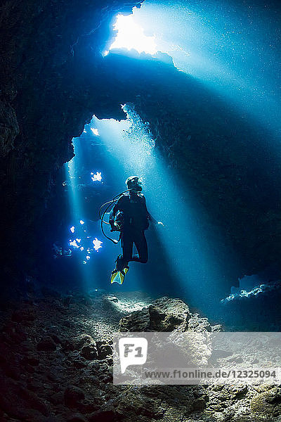 Diver inside a cavern known as First Cathedral off the island of Lanai; Hawaii  United States of America