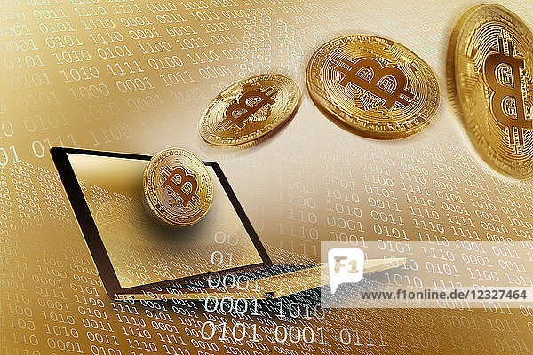 Golden Bitcoins over laptop