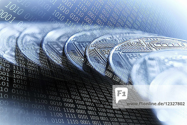 Bitcoins on blue binary code background