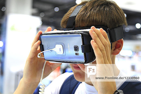 Teenager using augmented reality mask.