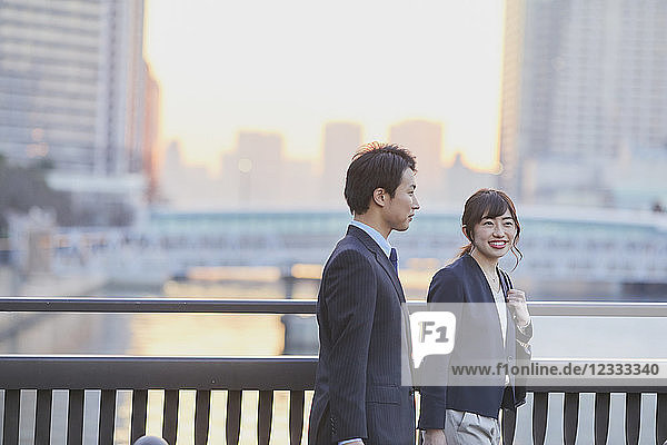 Japanese couple walking home from work