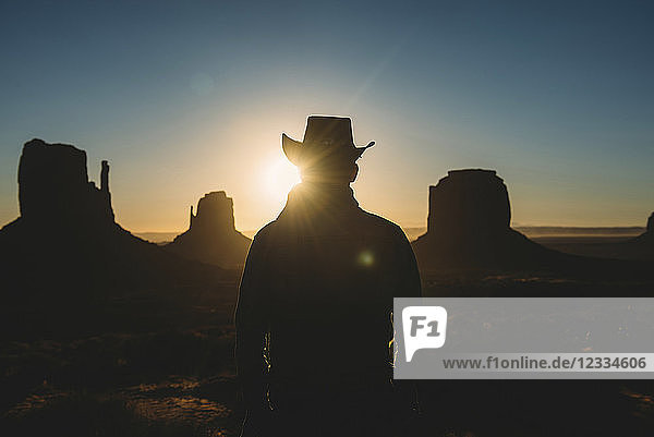 USA  Utah  Man with cowboy hat enjoying sunrise in Monument Valley