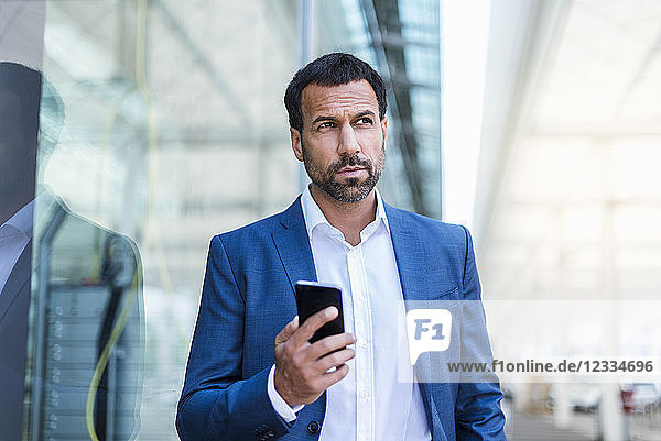 Businessman holding smartphone