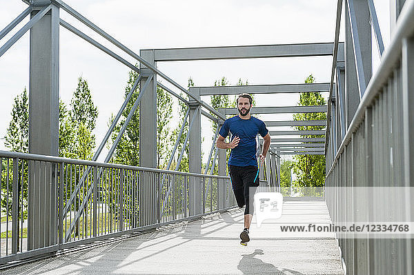 Man running on a bridge