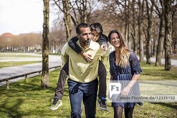 Happy family walking in a park
