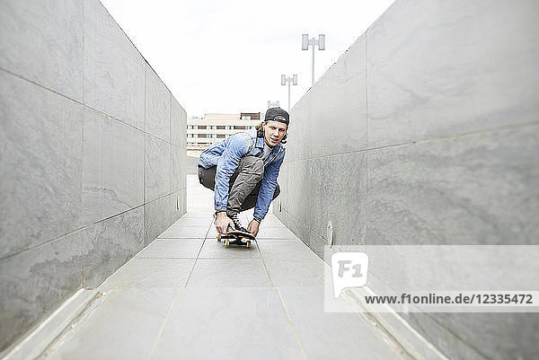 Young man skateboarding in the city