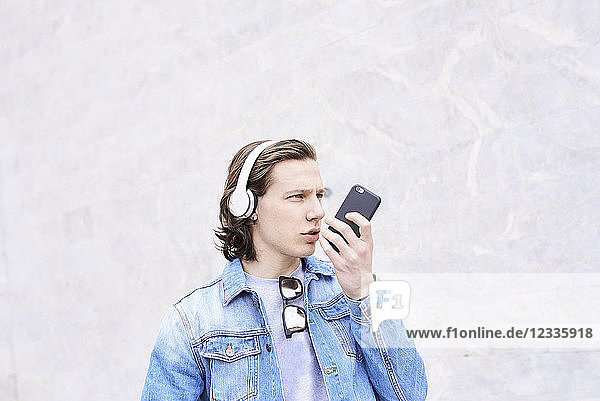 Young man in the city talking on the phone