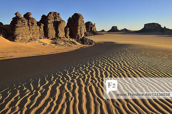 Africa  Algeria  Sahara  Tassili N'Ajjer National Park  Tadrart  Rock towers and sand dunes in Tiou Tatarene