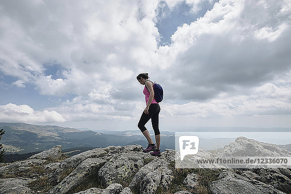Bulgaria  Rila Mountain  female hiker standing on cliff edge
