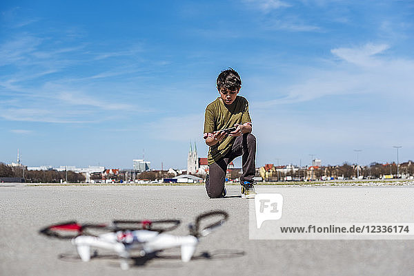 Boy flying drone