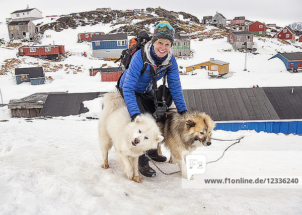 Greenland  Kulusuk  woman with Greenland huskies